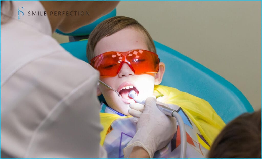 Reception at the dentistry the boy takes a stomatology treatment